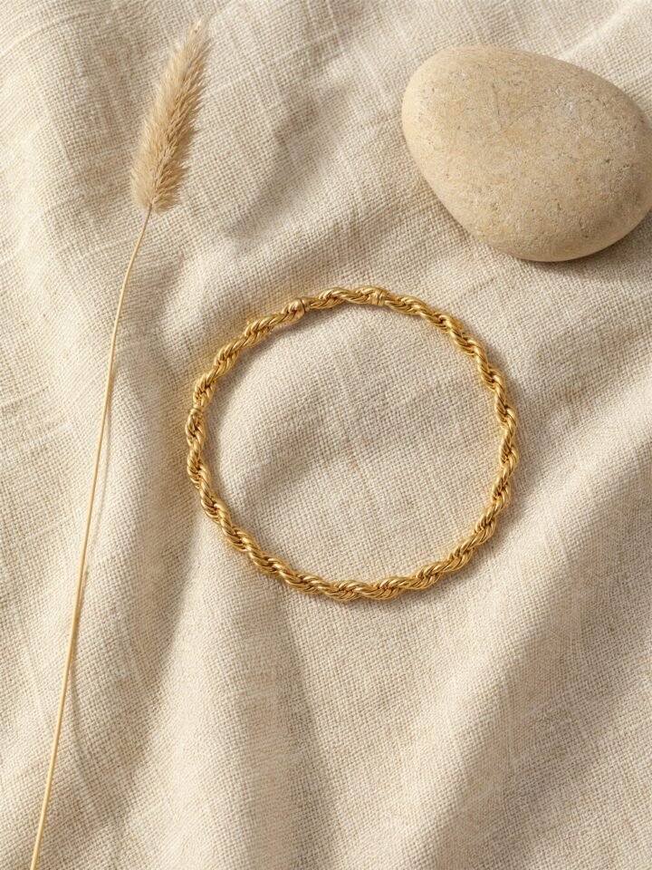Twist Brass Bangle in gold-tone